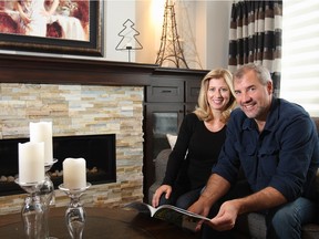 Diane Benoit-Hill, and Chuck Stewart look over a trip planner for their condo at Toscana of Desert Ridge, in Scottsdale, Ariz.