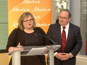 Health Minister Sarah Hoffman and Infrastructure Minister Brian Mason speak at a news conference in Edmonton on Oct. 28, 2015.