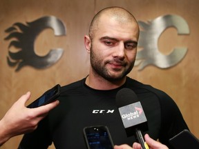 Calgary Flames captain Mark Giordano talks with the media following the team's ninth regulation loss in 13 games on Wednesday Nov. 4, 2015.  The burden falling on the shoulder of captains in Canadian markets is a big one.