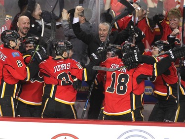 Players on the Calgary Flames bench and head coach Bob Hartley went crazy after centre Jiri Hudler scored the third goal of the game against the LA Kings during third period NHL action at the Scotiabank Saddledome on April 9, 2015. The Flames clinched a spot into the postseason thanks to a 3-1 win over the Kings.