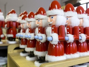 Finished hand-made wooden nutcracker figures are displayed at the Seiffener Volkskunst Christmas decorations manufactory on November 20, 2012 in Seiffen, Germany.