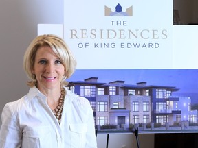 Rockwood Custom Homes owner Allison Grafton, next to a rendering of the company's Residences at King Edward project.