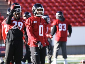 Ciante Evans, centre, awaits a change in practice exercises at McMahon Stadium. The rookie out of Nebraska will start in place of injured veteran Fred Bennett in Sunday's CFL West Division semifinal.