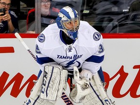 The Calgary Flames acquired goalie Kevin Poulin from the Tampa Bay Lightning on Thursday for future considerations.