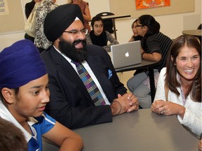 Calgary-Greenway MLA Manmeet Bhullar and Calgary Board of Education trustee Sheila Taylor hobnob with Grade 8 students, including Sukhman Bhat and Namra Zia, Tuesday Aug. 28, 2012 on a tour of newly opened Ted Harrison Middle School in Taradale.