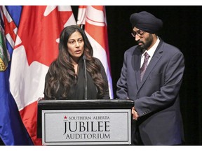 Tarjinder Kaur Bhullar and brother Appy Singh Bhullar speak at a state memorial service for their brother, Alberta MLA Manmeet Bhullar, at the Jubilee Auditorium, in Calgary, on Sunday, Nov. 29, 2015.