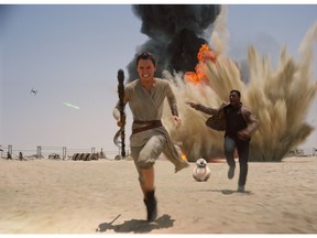 This photo provided by Disney shows Daisey Ridley as Rey, left, and John Boyega as Finn, in a scene from the new film, "Star Wars: The Force Awakens." Daniel Fleetwood, a 31-year-old Texan who is suffering from cancer, had his wish granted to see the highly anticipated new "Star Wars" film on Thursday, Nov. 4. His wife Ashley celebrated on her Facebook page that Daniel saw an unfinished version of the movie thanks to the film's producers and director J.J. Abrams. The movie releases in the U.S. on Dec. 18, 2015. (Film Frame/Disney/Lucasfilm via AP)