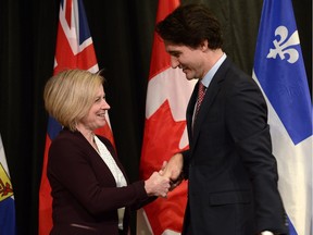 Prime Minister Justin Trudeau welcomes Alberta Premier Rachel Notley to the First Ministers meeting at the Canadian Museum of Nature in Ottawa on Nov. 23, 2015.