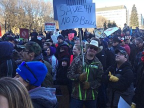 Farmer Scott Anderson protests Bill 6 Monday at a rally outside the legislature in Edmonton.