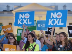 Activists celebrate U.S. President Barack Obama's blocking of the Keystone XL oil pipeline in front of the White House in November.