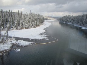 Pictures of a 100 km long leak of coal mine sludge, making its way down the Athabasca River.