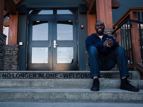 Tong Liech sits on the 12th step of the entrance stairway to the Fresh Start Recovery Centre in Calgary on Tuesday, Oct. 27, 2015.