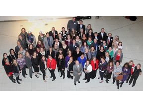 Representatives of many of the recipient agencies from the past 25 years gather for a group photo during the Calgary Herald Christmas Fund 2015 launch Nov. 17, 2015 at Telus Spark.