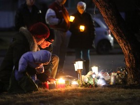 Calgarians attend a one year anniversary candle light vigil for the victims of the Brentwood murders in Calgary, on April 14, 2015. (Christina Ryan/Calgary Herald)