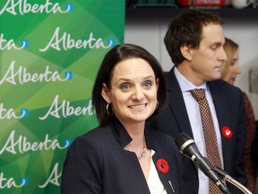 Municipal Affairs Minister Danielle Larivee, pictured with High River Mayor Craig Snodgrass in November 2015.