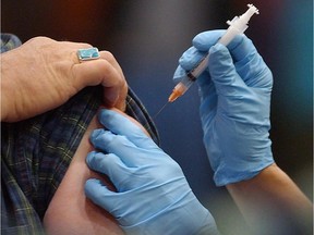A flu shot is administered in Barre, Vt., Nov.18, 2004. THE CANADIAN PRESS/AP/Toby Talbot