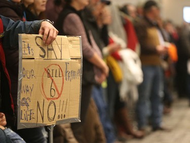 Protesters of Bill 6 line up against the wall in an over-capacity Harvest Centre at Westerner Park in Red Deer on Tuesday, Dec. 1, 2015.