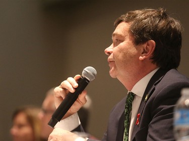 Alberta's Agriculture Minister Oneil Oneil Carlier speaks to protesters of Bill 6 at Westerner Park in Red Deer on Tuesday, Dec. 1, 2015.