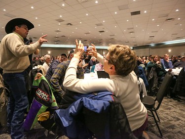 A man addresses the packed Harvest Centre during a Bill 6 consultation at Westerner Park in Red Deer on Tuesday, Dec. 1, 2015.