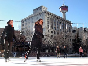 Angelica Janik, left, and Tracy Fong enjoy a relaxing lunchhour skate in the sunshine on the Olympic Plaza rink Tuesday, Dec. 1, 2015. Predictions are for a sunny and warmer than usual winter this year.