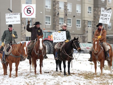 Alberta ranchers, from left, Kim Cochlan, Harley Green, Larry Sears and Callum Sears were among hundreds of local farmers and ranchers to protest against Bill 6.