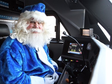 WestJet's Blue Santa got the opportunity to take a look in the cockpit of an UPTrain in Toronto, ON. following a trip up the CN Tower on Dec. 9, 2015 during the 12,000 Mini Miracle day.