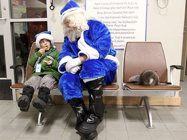 WestJet's Blue Santa sat with five-year-old Daniel Studney after arriving in Yellowknife, NT on December 9, 2015 as he made his way across the country for WestJets Mini Miracle Day. He started the morning in Halifax and finished in Vancouver with stops in Toronto and Yellowknife. At the airport, Blue Santa gave Studney's family a trip anywhere Westjet flies.