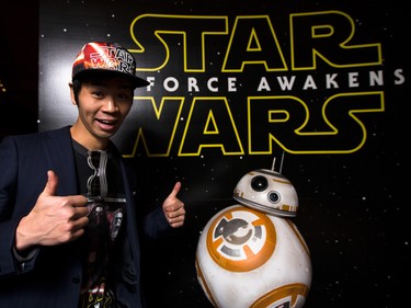 Aki Takahashi throws two thumbs up prior to the Star Wars opening weekend at Chinook Cineplex in Calgary on Thursday, Dec. 17, 2015.