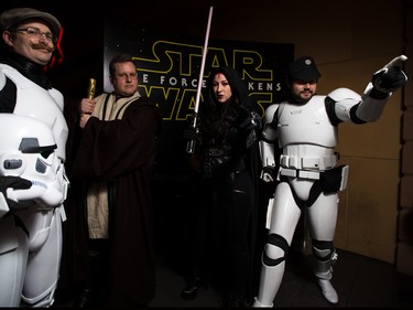 Stormtrooper Jeff Schultz, left, stands along side Jedi Kris Joosten, Sith Dara Defreitas, and Stormtrooper commander Peter White at the Star Wars opening weekend at Chinook Cineplex in Calgary on Thursday, Dec. 17, 2015.