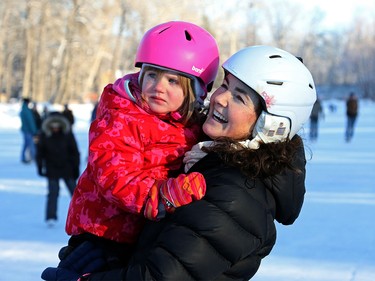 Hana Loewen, 4, and her mom Andrea enjoy a chilly white Christmas Day at Bowness Park lagoon for skating, in Calgary on December 25, 2015.