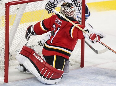 Calgary Flames goalie Karri Ramo makes a save during their game against the Winnipeg Jets  at the Scotiabank Saddledome in Calgary on December 22, 2015.