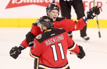 Calgary Flames Joe Colborne, right, celebrates his goal on Winnipeg jets with teammate Mikael Backlund during their game at the Scotiabank Saddledome in Calgary on December 22, 2015.