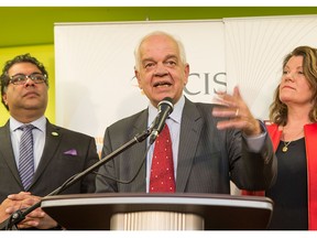 John McCallum, Minister of Immigration, Refugees and Citizenship, centre, Lori Sigurdson, Minister of Advanced Education and Minister of Jobs, Skills, Training and Labour for Alberta, right, and Calgary mayor Naheed Nenshi provide media with an update after a meeting with a range of local stakeholders regarding the plan to resettle Syrian refugees in Calgary, on Dec. 2, 2015.