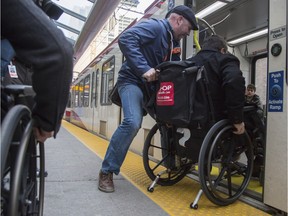 For the international day of Persons with Disabilities, the City of Calgary's Advisory Committee on Accessibility hosted an accessibility tour. Here, a participant experiences the struggles of boarding a Calgary LRT in a wheelchair.