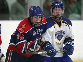 Regina Pats forward Tanner McKechnie, left, battled against Calgary Royals defenceman Liam McKay during game action at the Mac's AAA Midget Tournament at the Flames Community Arenas in Calgary on December 30, 2015.