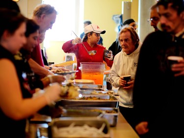 Residents take part in the Christmas feast at the Calgary Drop-In and Rehab Centre on Dec. 25, 2015.