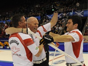 Craig Savill, right, celebrates the 2012 world curling championship title with teammates Wayne Middaugh, left, and Glenn Howard. On Monday, it was revealed that Savill is battling Hodgkins Lymphoma.