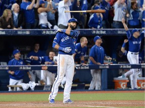 Toronto Blue Jays Jose Bautista flips his bat after hitting a three-run homer during seventh inning game 5 American League Division Series baseball action in Toronto on Wednesday, Oct. 14, 2015.