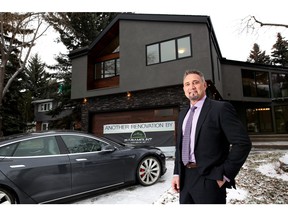 Realtor Keith Crawford with Century 21 Bamber Realty  at one of his listings in Calgary on December 11, 2015, where they are also including a Tesla car in the sale.