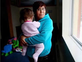 Melanie, a former client at Inn from the Cold, holds her eight-month-old daughter.