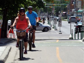 With the bike lanes opening, cyclists are enjoying the freedom of the new bike lane along 5th Street and 10th Ave intersection in Calgary, on June 11, 2015.