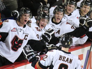 The Calgary Hitmen celebrate Jake Bean's goal in the closing minute of the first period against the Kootenay Ice. The game was the first in a best-of-seven playoff series against the Ice on Friday March 27, 2015.