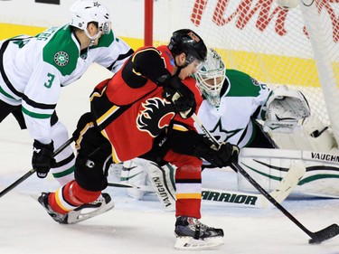 Calgary Flames centre Sam Bennett stretches for a shot on Dallas Stars goaltender Antti Niemi during NHL action in Calgary on Tuesday December 1, 2015.