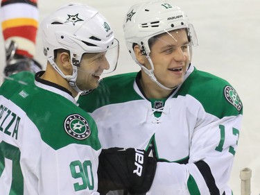 The Dallas Stars' Jason Spezza, left, and Mattias Janmark celebrate Spezza's goal against Calgary during NHL action on Tuesday December 1, 2015.