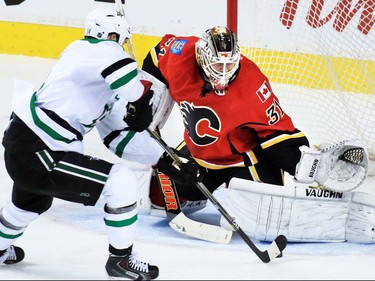 Calgary Flames goaltender Karri Ramo stops this scoring chance by Dallas Stars captain Jamie Benn during NHL action on Tuesday December 1, 2015.