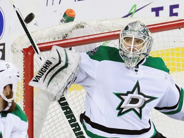 Dallas Stars goaltender Antti Niemi deflects this Calgary Flames shot  during second period NHL action on Tuesday December 1, 2015.