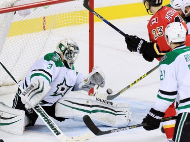 Dallas Stars goaltender Antti Niemi watches as the puck bounces off the post after a Calgary Flames scoring chance during second period NHL action on Tuesday December 1, 2015.