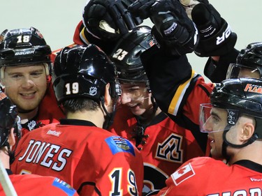 The Calgary Flames congratulate Sean Monahan after he scored the winning shoot out goal to defeat the Dallas Stars 4-3 in NHL action on Tuesday December 1, 2015.