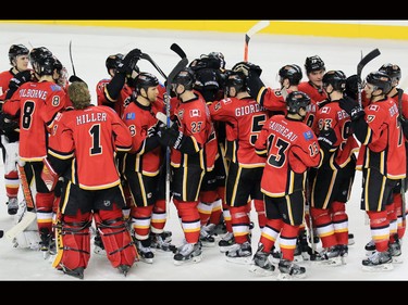 The Calgary Flames congratulate Sean Monahan after he scored the winning shoot out goal to defeat the Dallas Stars 4-3 in NHL action on Tuesday December 1, 2015.