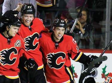 The Calgary Flames celebrate Sean Monahan's third period goal against the Dallas Stars in NHL action on Tuesday December 1, 2015.